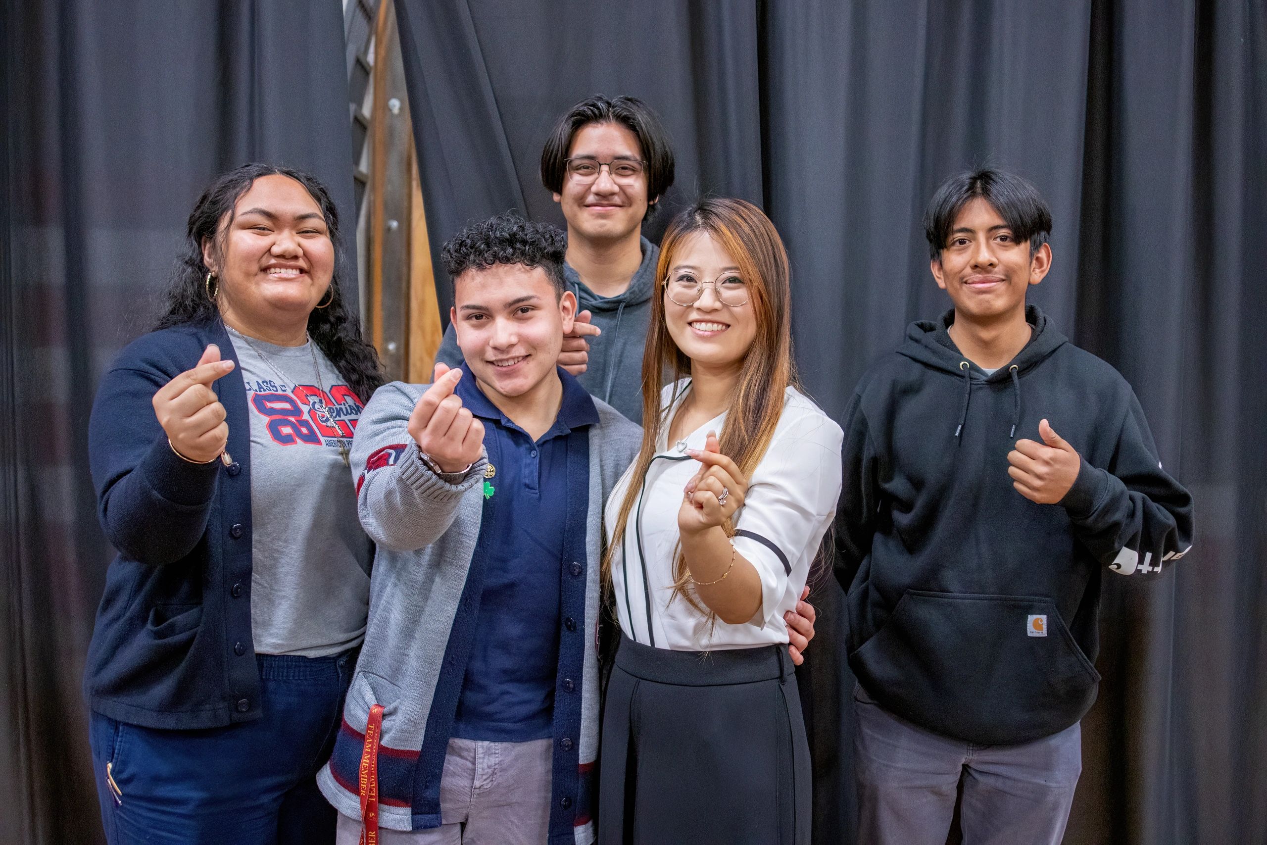 Young people smiling and hopeful